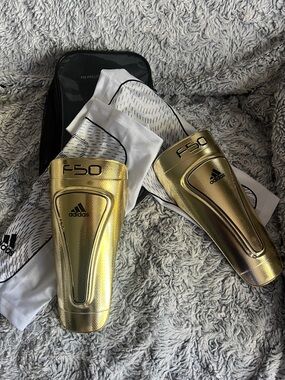 adidas Gold and Black F50 Pro-Lite Messi Shin Guards with Case